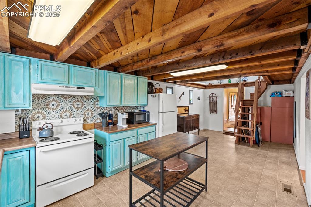 315 5th Street Victor, CO 80860 - Photo 3 of 15 a kitchen that has a table and chairs in it