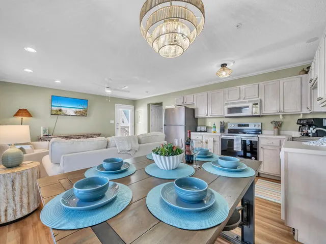 a view of a livingroom with furniture window and wooden floor