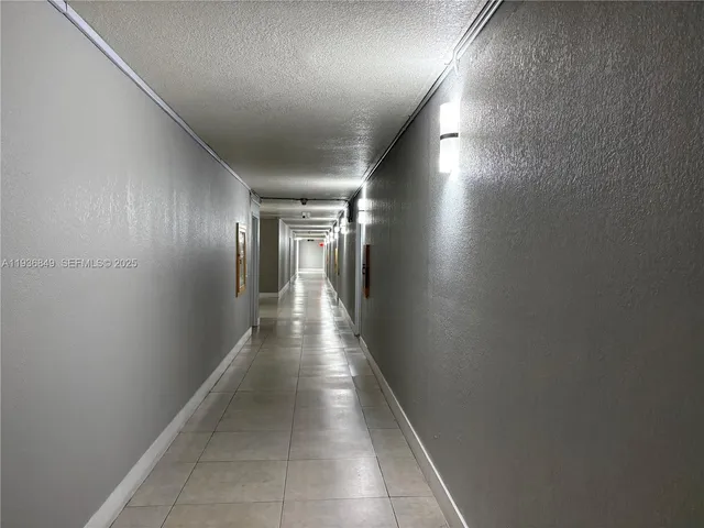 a view of an empty room and a window