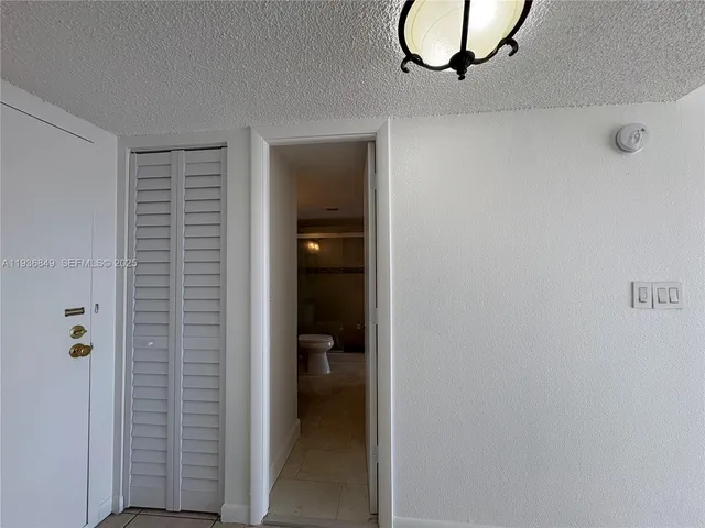 a kitchen with a refrigerator sink and microwave