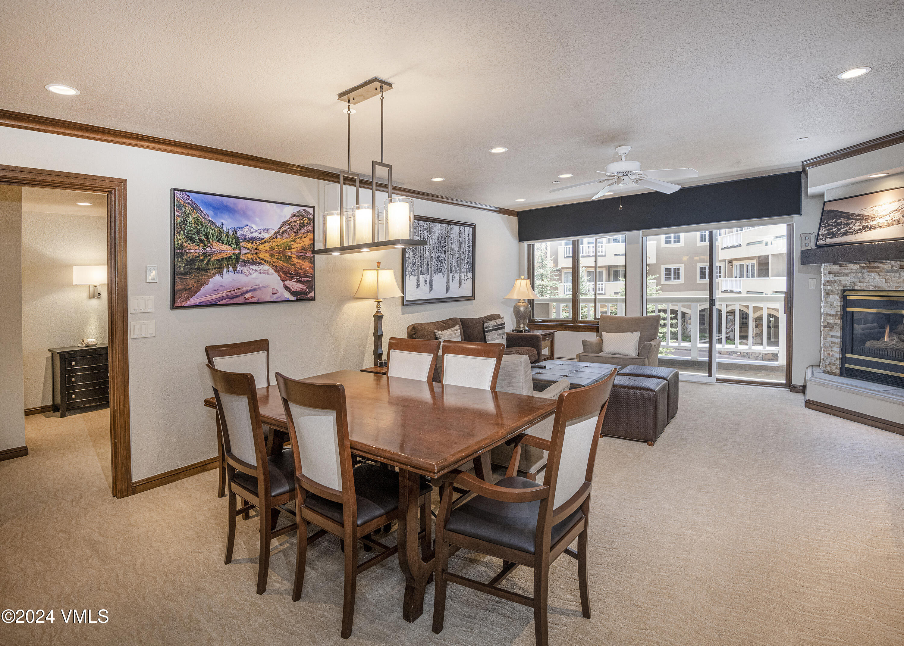 210 Offerson Road, Unit 3054 Beaver Creek, CO 81620 - Photo 3 of 7 a dining room with furniture a rug and painting on the wall