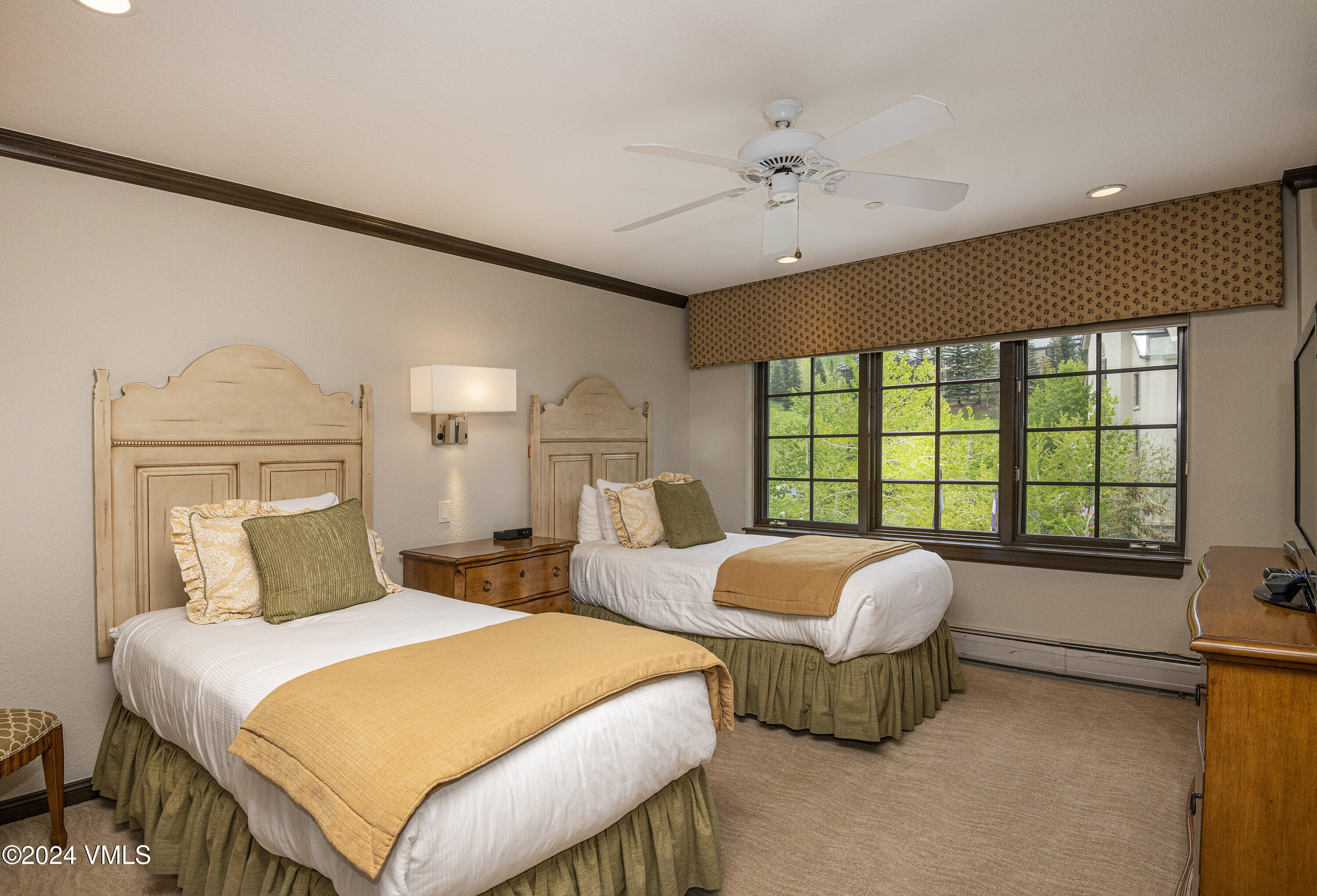 210 Offerson Road, Unit 3054 Beaver Creek, CO 81620 - Photo 6 of 7 a bedroom with two beds and a large window