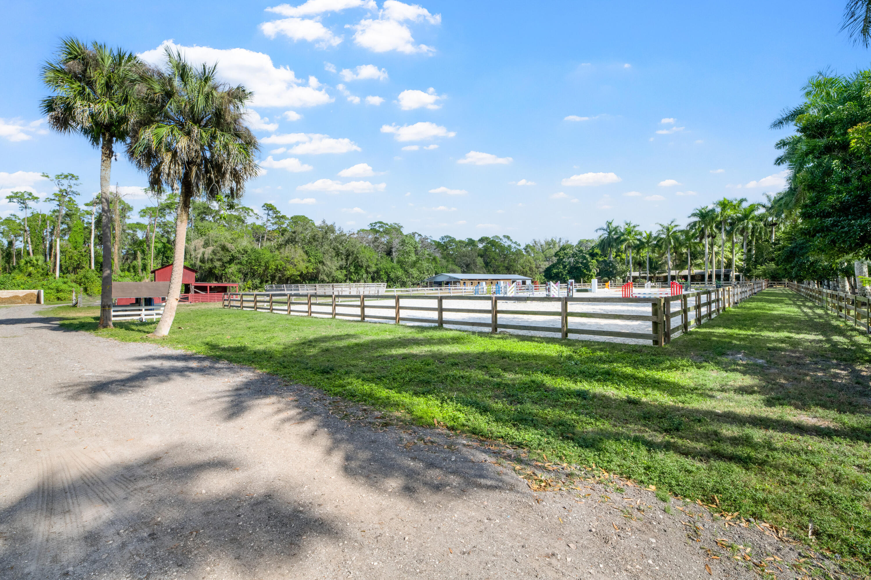 1068 D Road Loxahatchee, FL 33470 - Photo 23 of 73 a view of road with grass and a trees