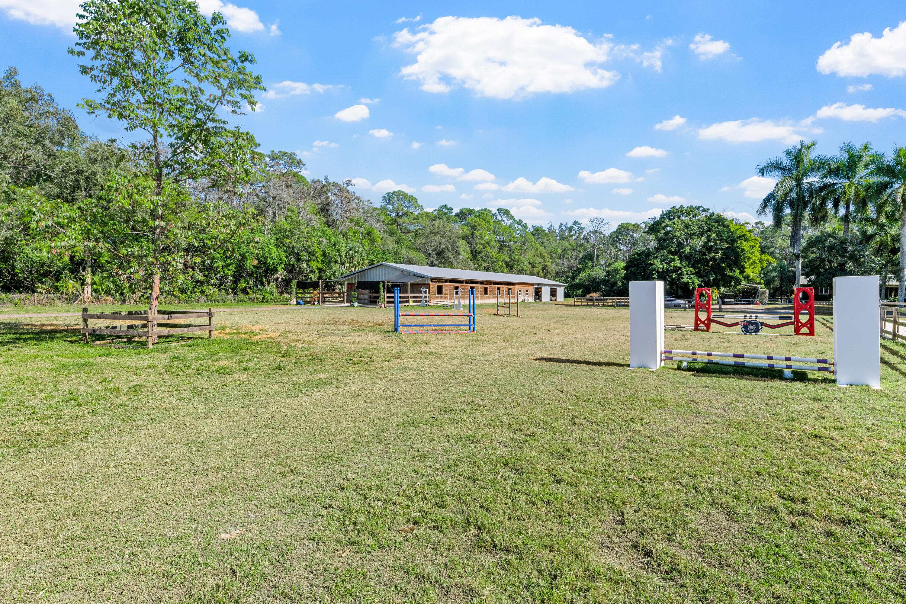 1068 D Road Loxahatchee, FL 33470 - Photo 28 of 73 a view of a park with swings and slides