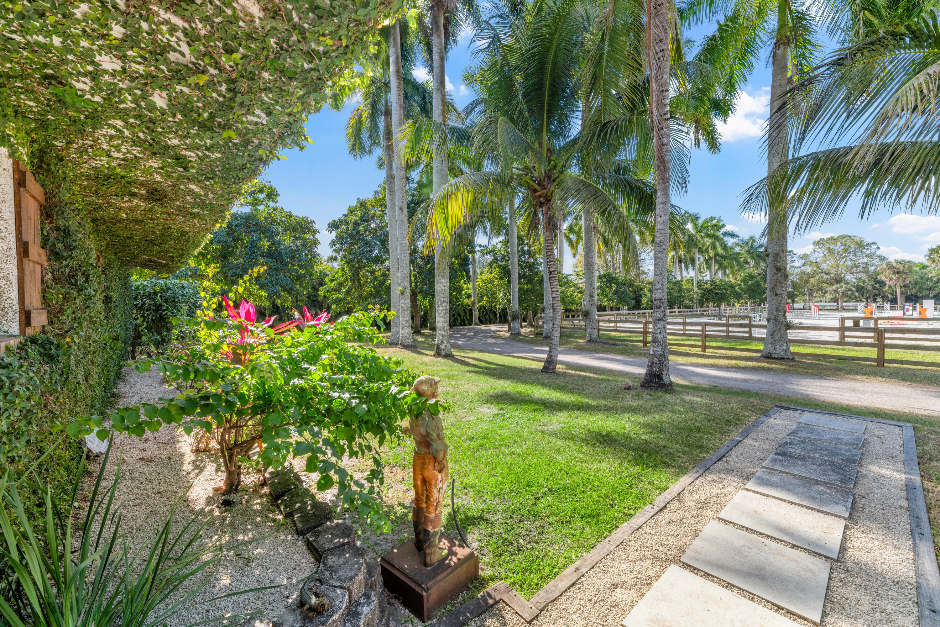 1068 D Road Loxahatchee, FL 33470 - Photo 56 of 73 a view of a yard with palm trees