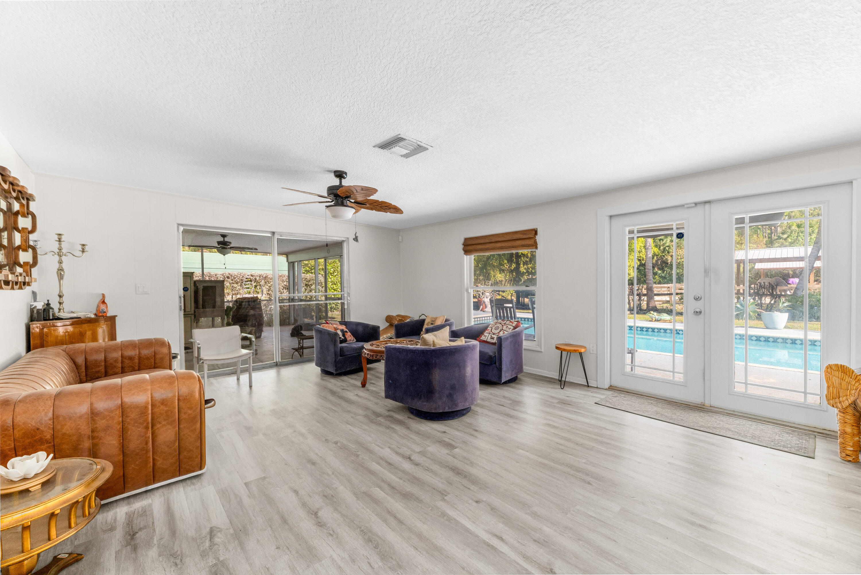 1068 D Road Loxahatchee, FL 33470 - Photo 58 of 73 a living room with furniture and wooden floor