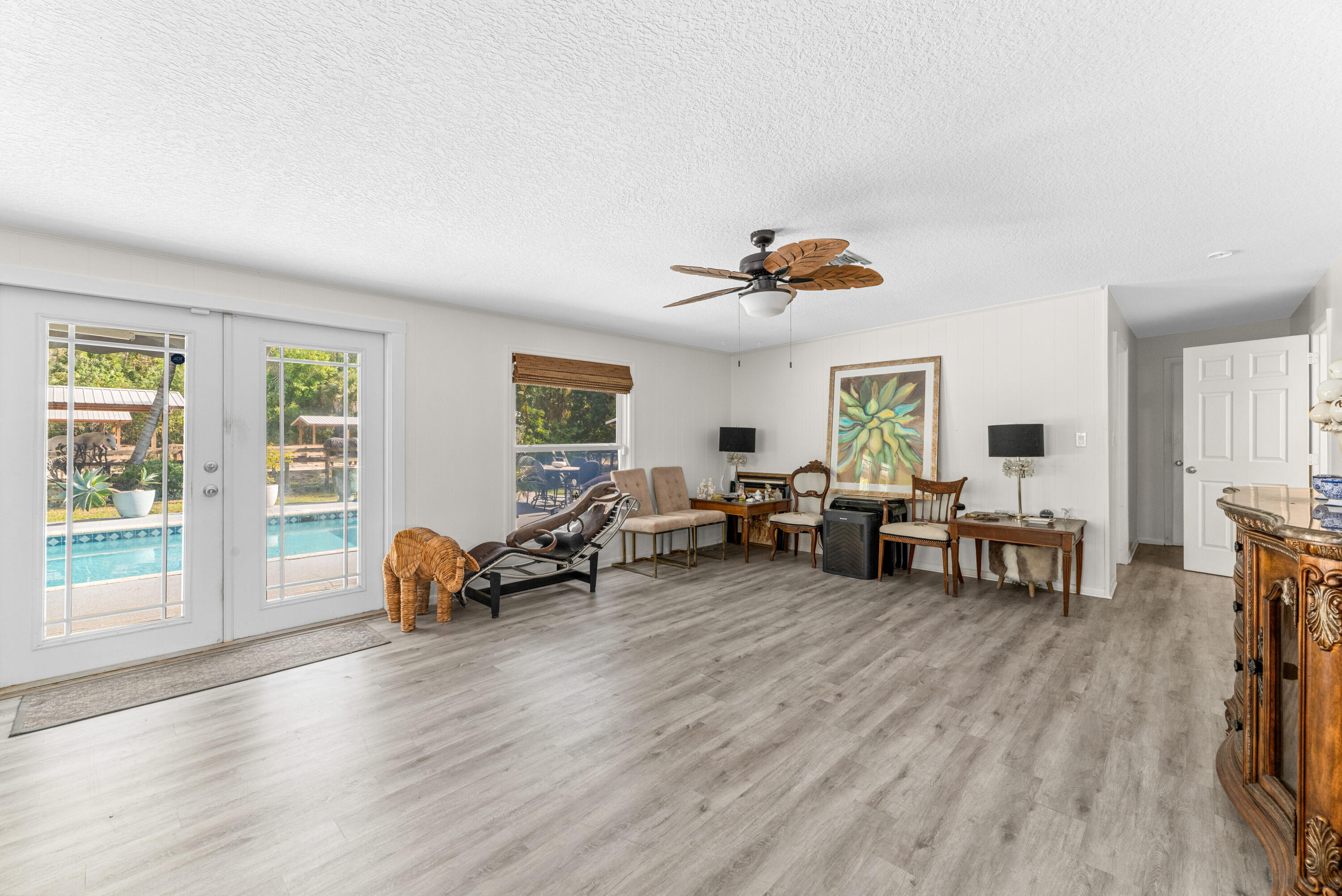 1068 D Road Loxahatchee, FL 33470 - Photo 59 of 73 a living room with furniture and a large window