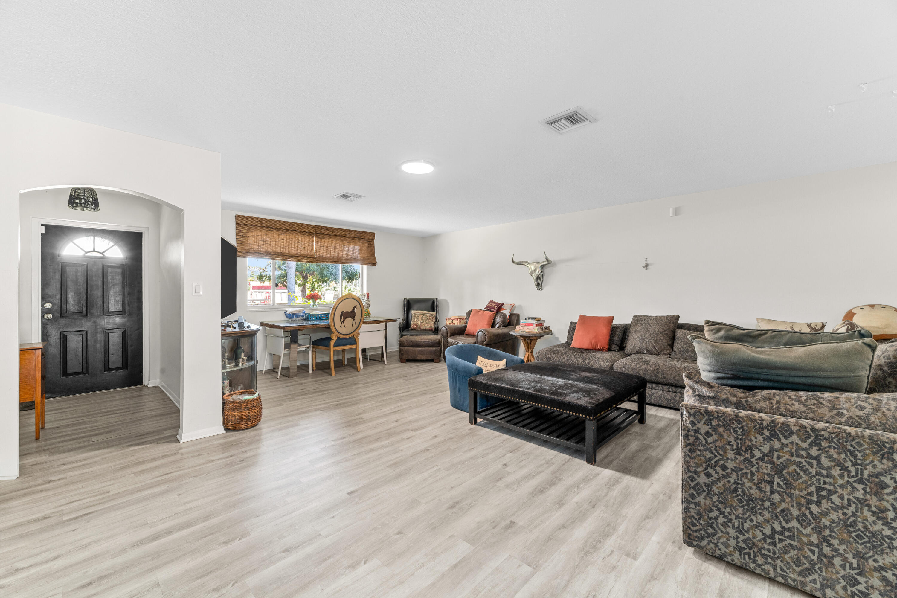 1068 D Road Loxahatchee, FL 33470 - Photo 60 of 73 a living room with furniture and wooden floor