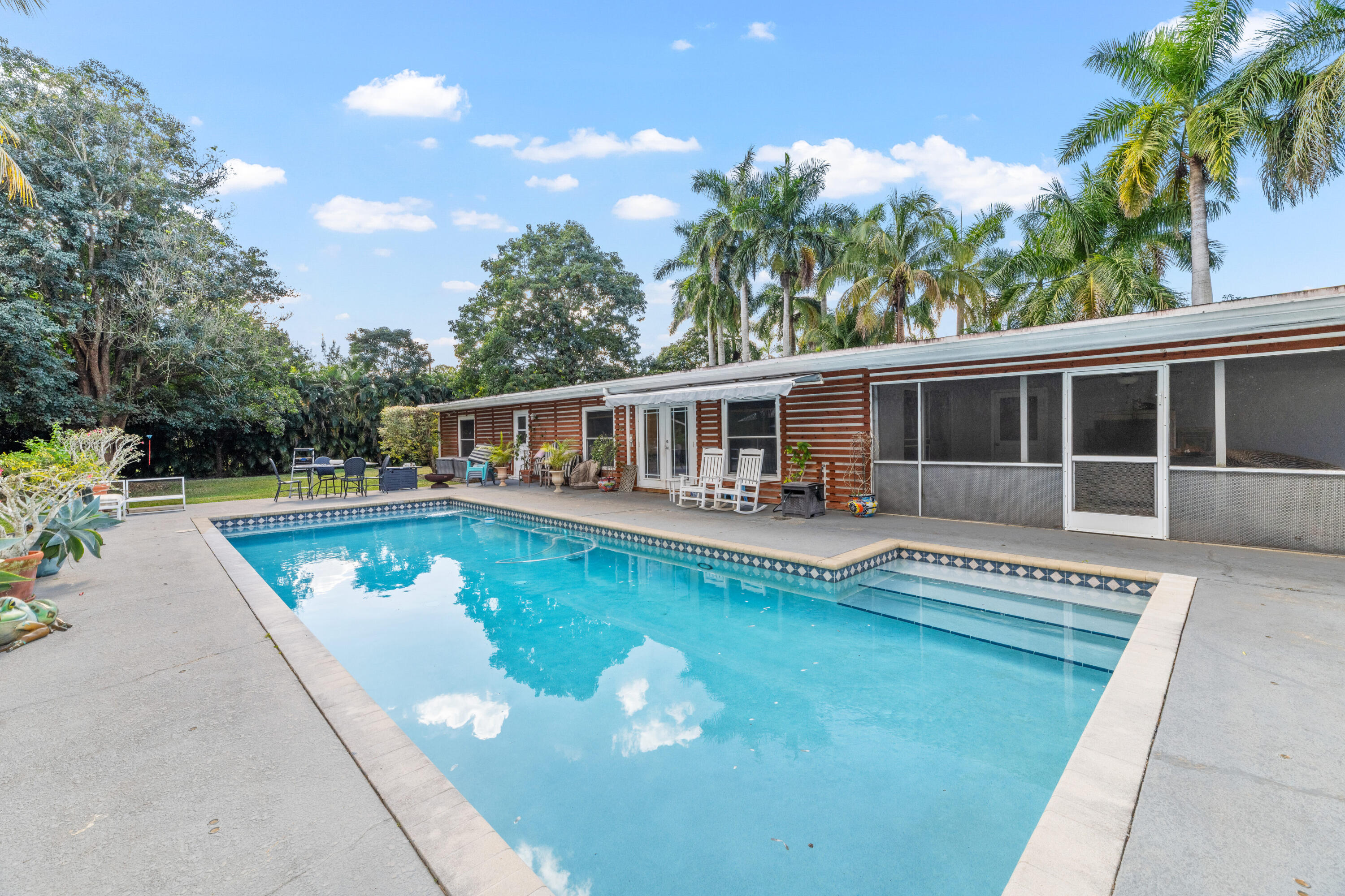 1068 D Road Loxahatchee, FL 33470 - Photo 69 of 73 swimming pool view with a garden space