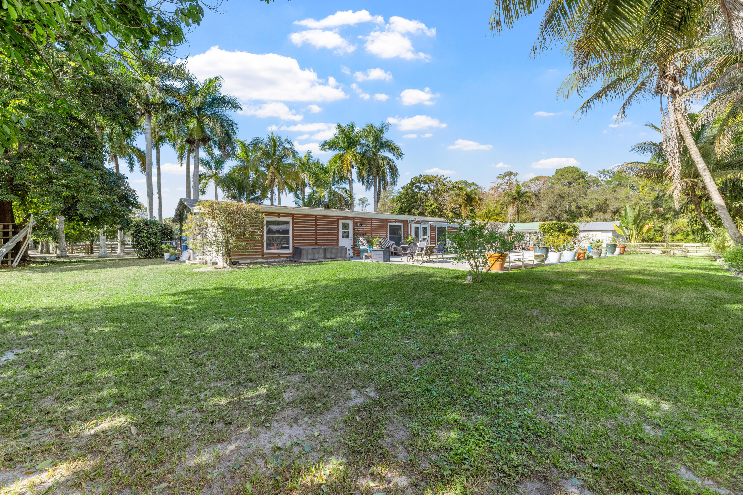 1068 D Road Loxahatchee, FL 33470 - Photo 73 of 73 a view of a house with a yard