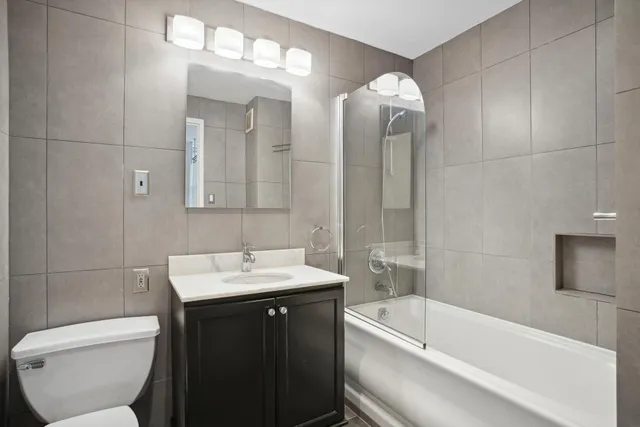 a bathroom with a sink a toilet and bathtub