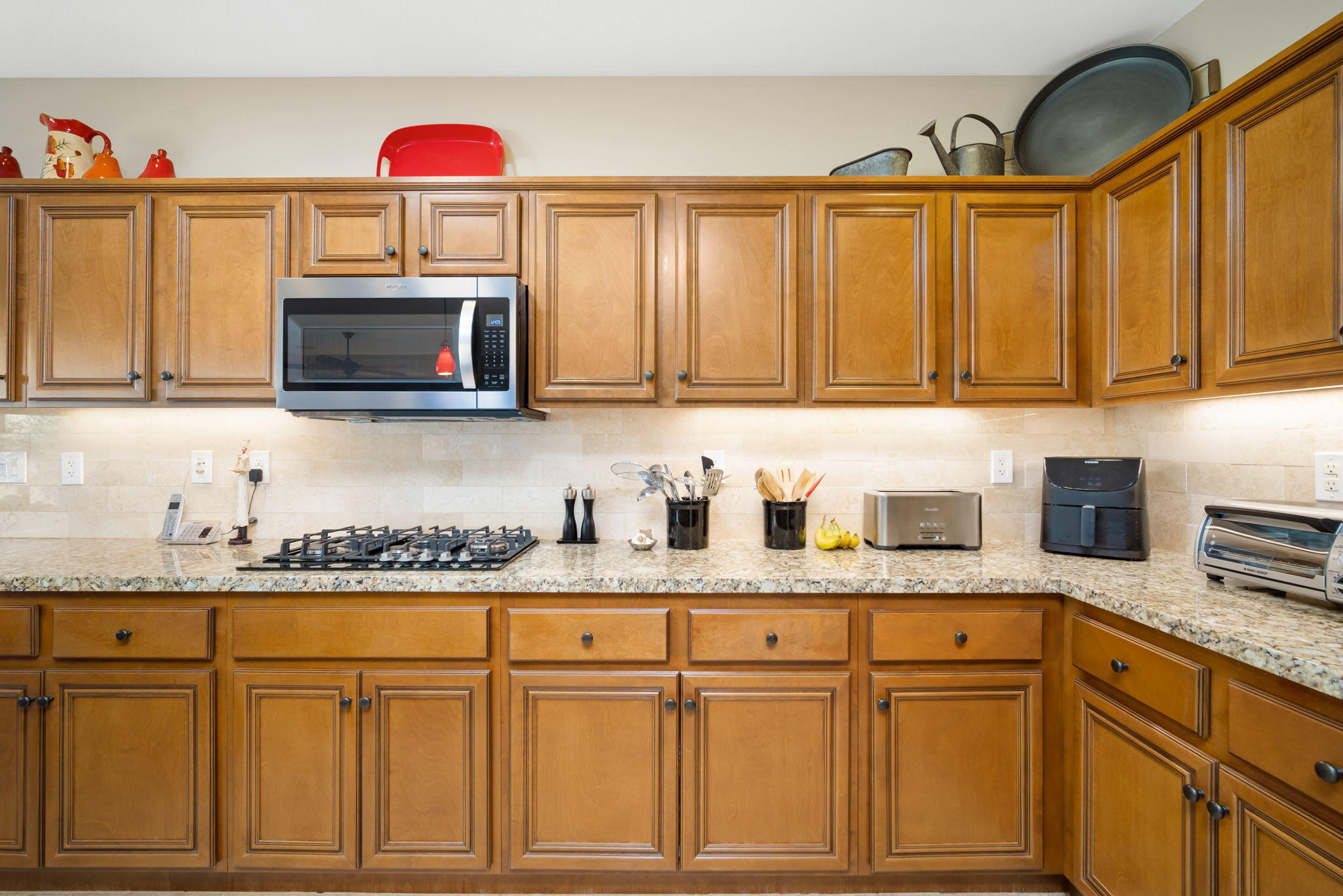 81820 Rustic Canyon Drive La Quinta, CA 92253 - Photo 19 of 85 a kitchen with granite countertop a stove microwave and sink