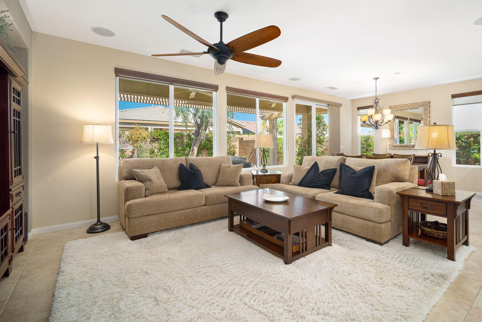 81820 Rustic Canyon Drive La Quinta, CA 92253 - Photo 8 of 85 a living room with furniture a ceiling fan and a large window