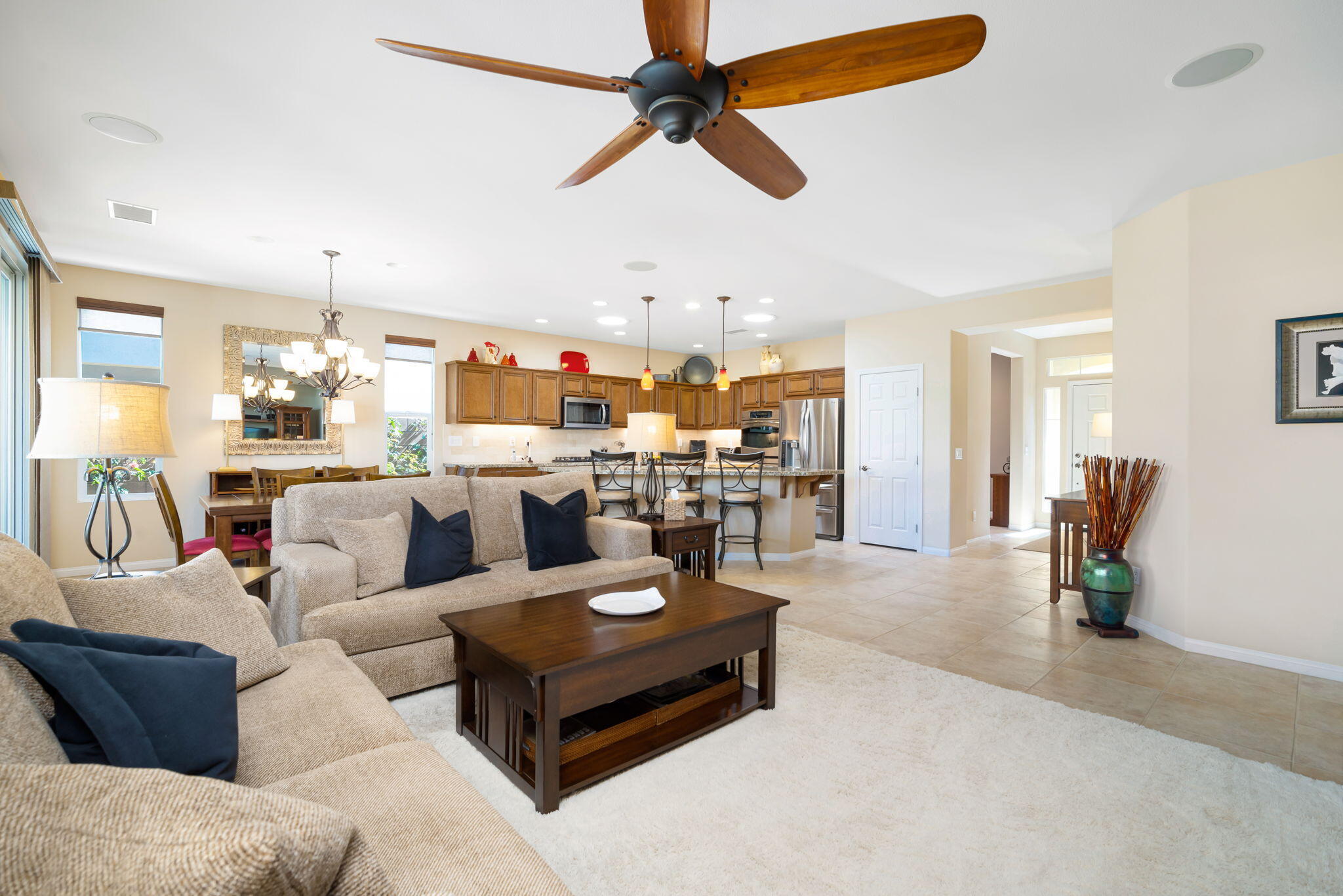 81820 Rustic Canyon Drive La Quinta, CA 92253 - Photo 9 of 85 a living room with furniture kitchen view and a chandelier