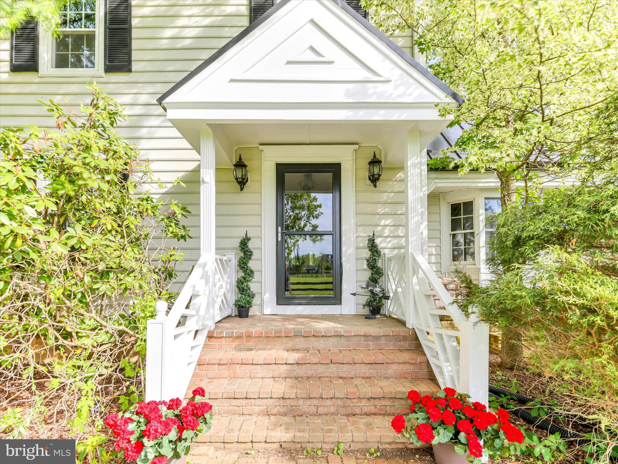 19255 Telegraph Springs Road Purcellville, VA 20132 - Photo 2 of 107 a front view of a house with a porch