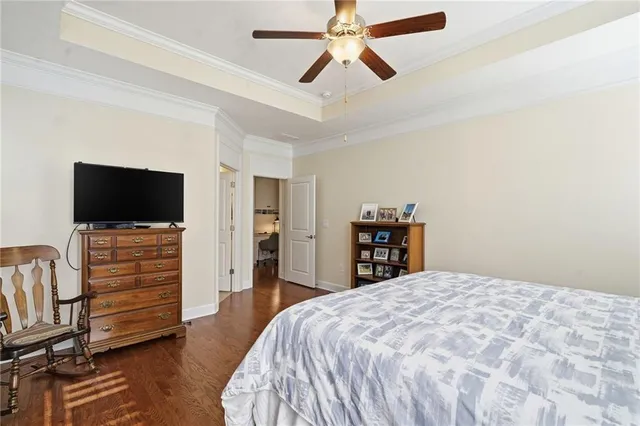 a bathroom with a granite countertop tub sink and mirror