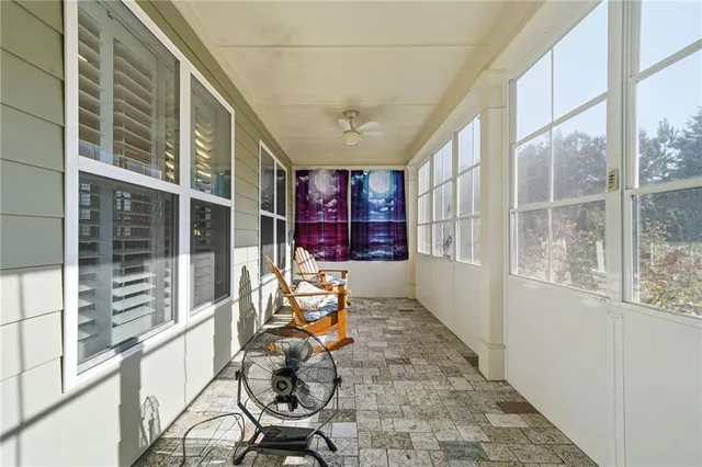 a front view of a house with outdoor seating