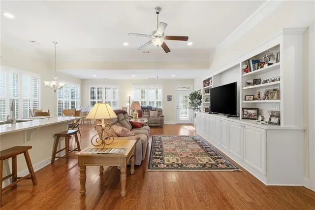 a living room with furniture and kitchen view