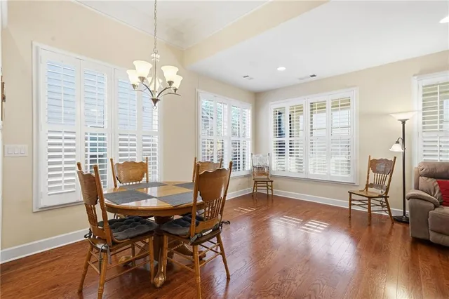 a kitchen with sink a stove and cabinets