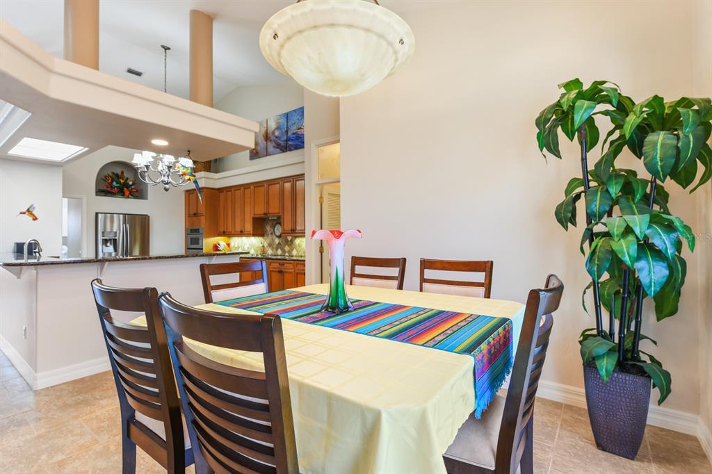 4911 Linkside Drive Punta Gorda, FL 33955 - Photo 23 of 64 a dining room with furniture and a potted plant