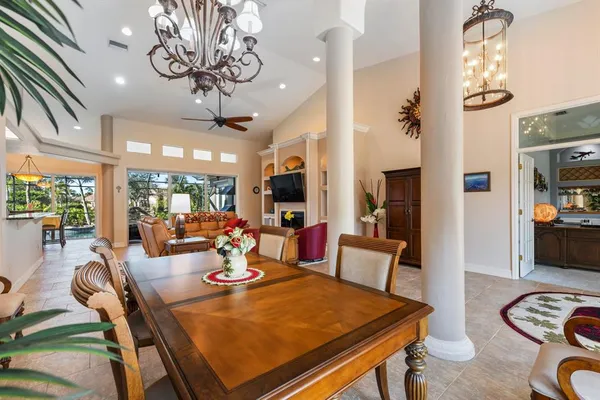 a living room with furniture a large window and a fireplace