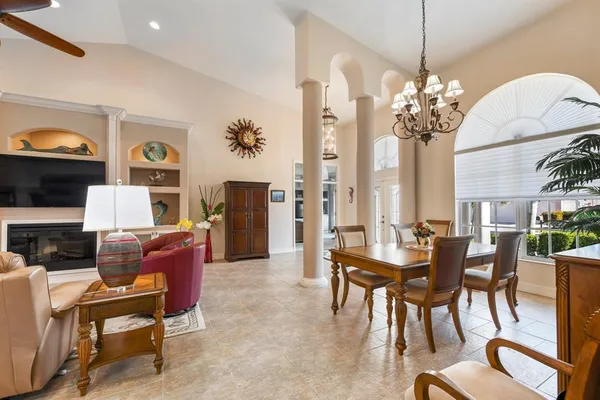 a living room with fireplace furniture and a flat screen tv
