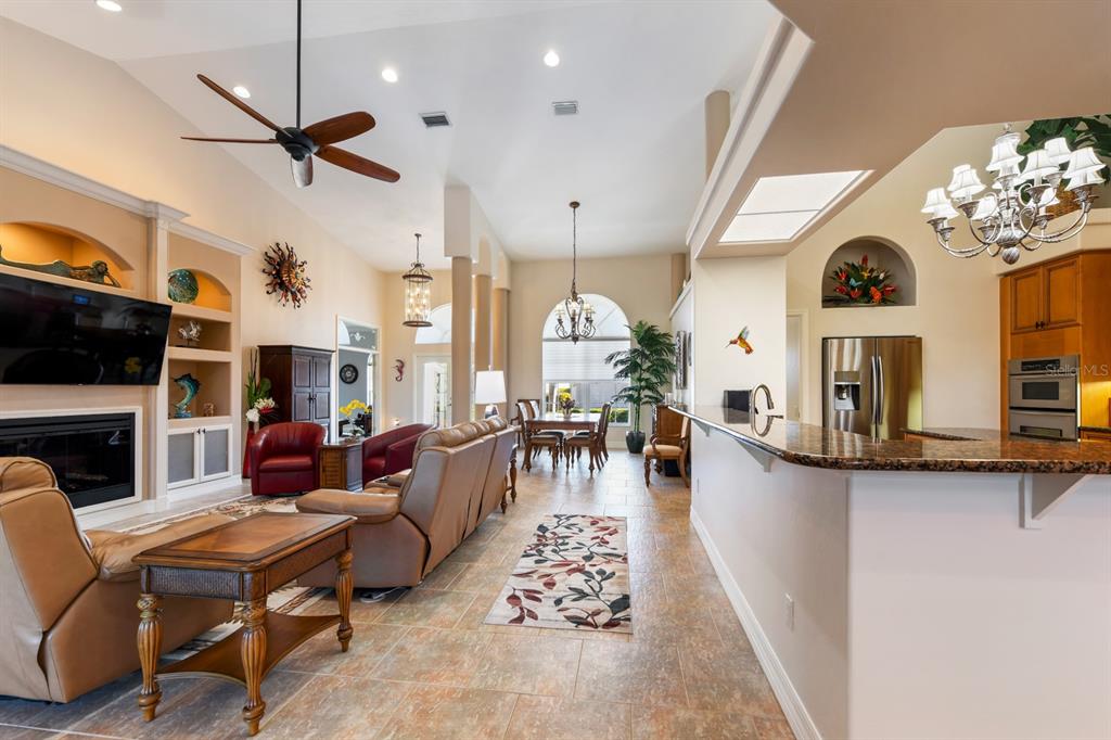 4911 Linkside Drive Punta Gorda, FL 33955 - Photo 7 of 64 a living room with fireplace furniture and a flat screen tv