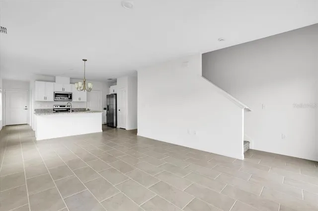a view of a kitchen with a sink cabinets and a window
