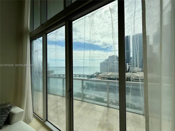 a bathroom with a glass door and shower