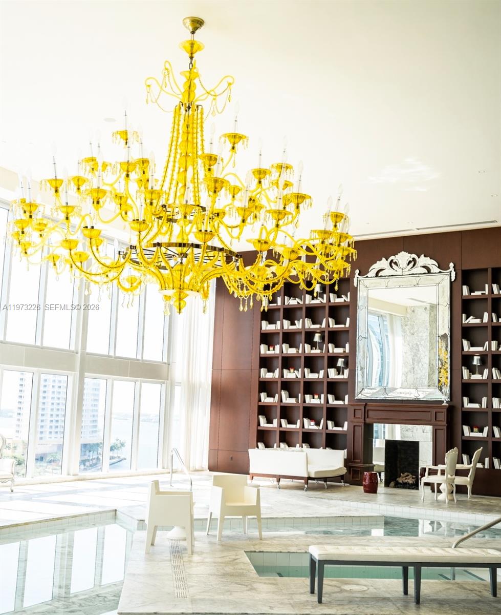 495 Brickell Avenue, Unit 1403 Miami, FL 33131 - Photo 39 of 48 a view of spacious bedroom with a chandelier