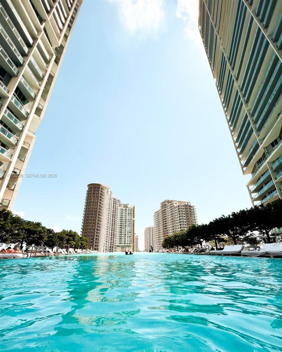 495 Brickell Avenue, Unit 1403 Miami, FL 33131 - Photo 45 of 48 a view of a garden with a building in the background