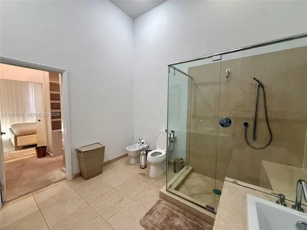 a bathroom with a toilet and shower