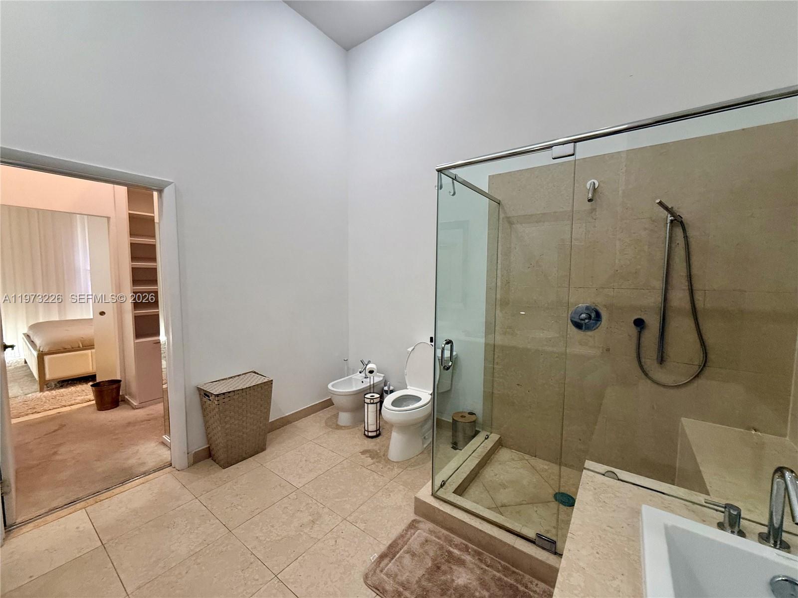 495 Brickell Avenue, Unit 1403 Miami, FL 33131 - Photo 7 of 48 a bathroom with a toilet and shower