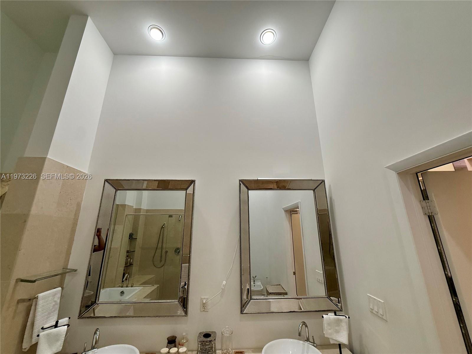 495 Brickell Avenue, Unit 1403 Miami, FL 33131 - Photo 10 of 48 hallway with mirror and window