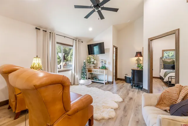 a living room with furniture and a large window