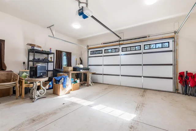 a view of a garage with rack and bicycle