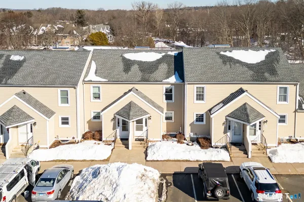 a view of a house with snow on the background