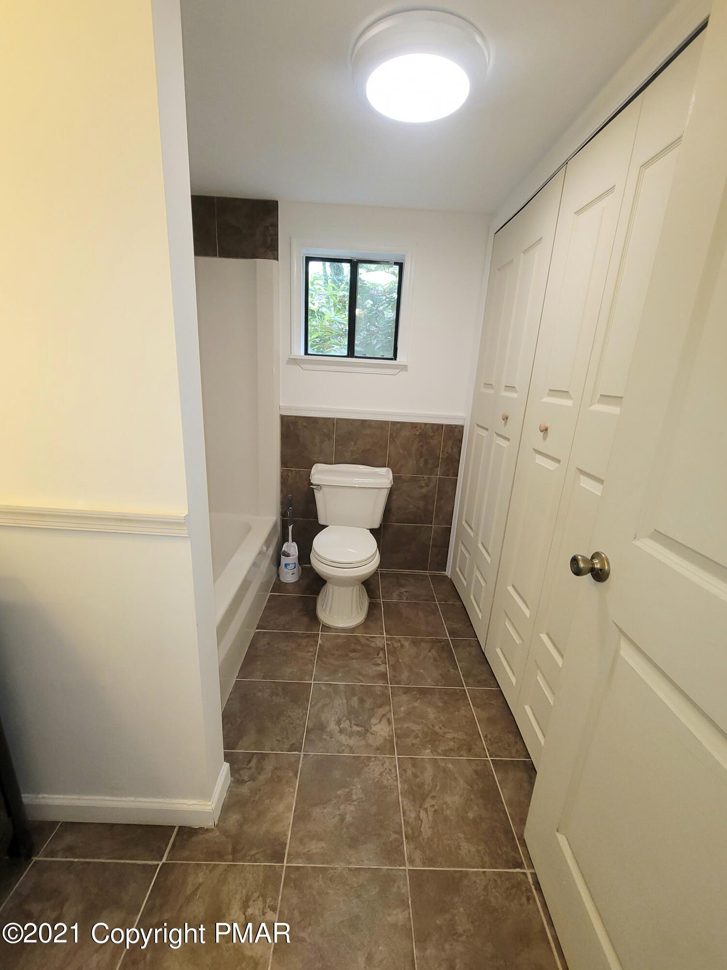 3153 Cherry Ridge Road Bushkill, PA 18324 - Photo 11 of 41 a bathroom with a toilet and a shower