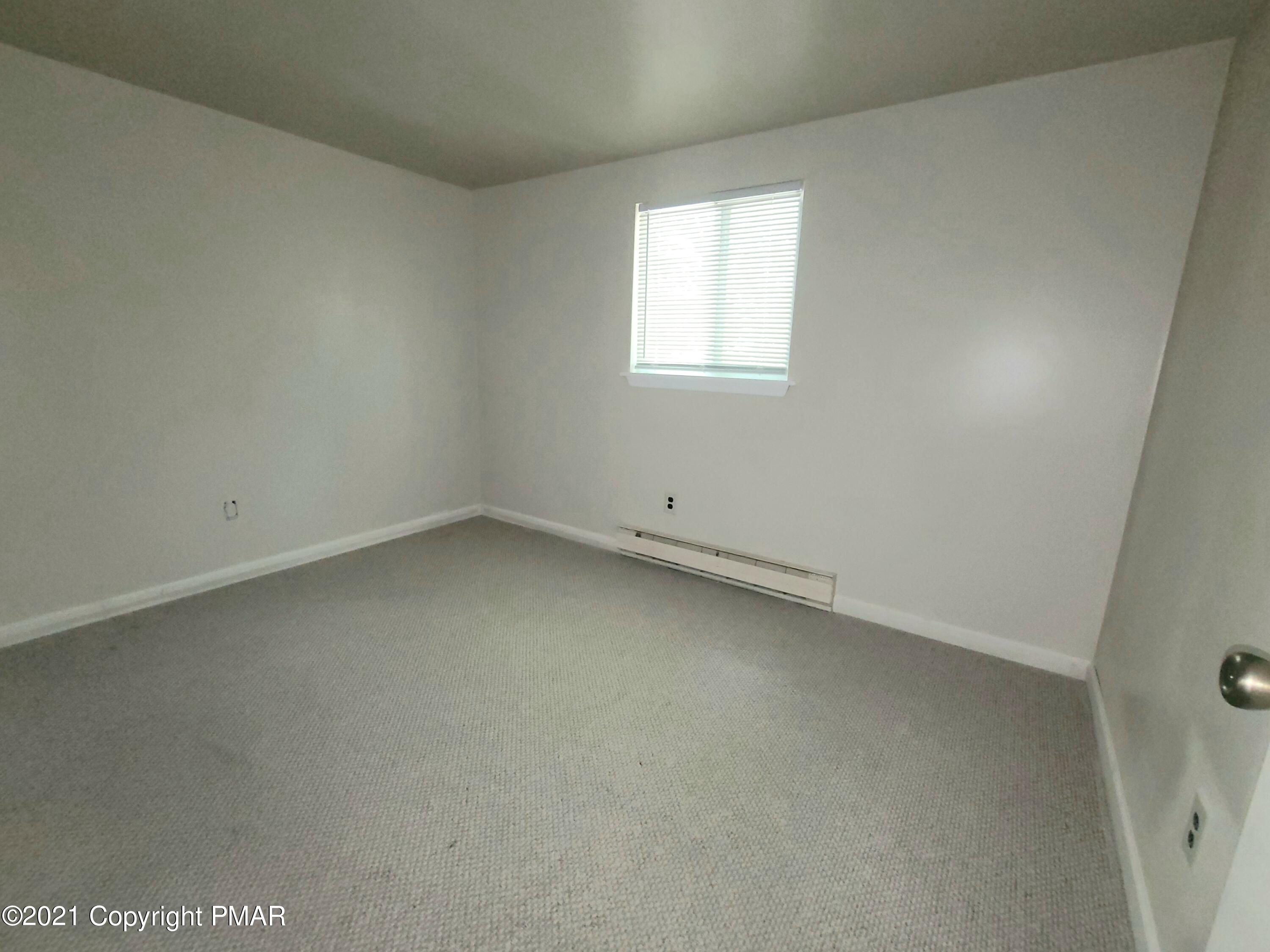3153 Cherry Ridge Road Bushkill, PA 18324 - Photo 18 of 41 an empty room with a window