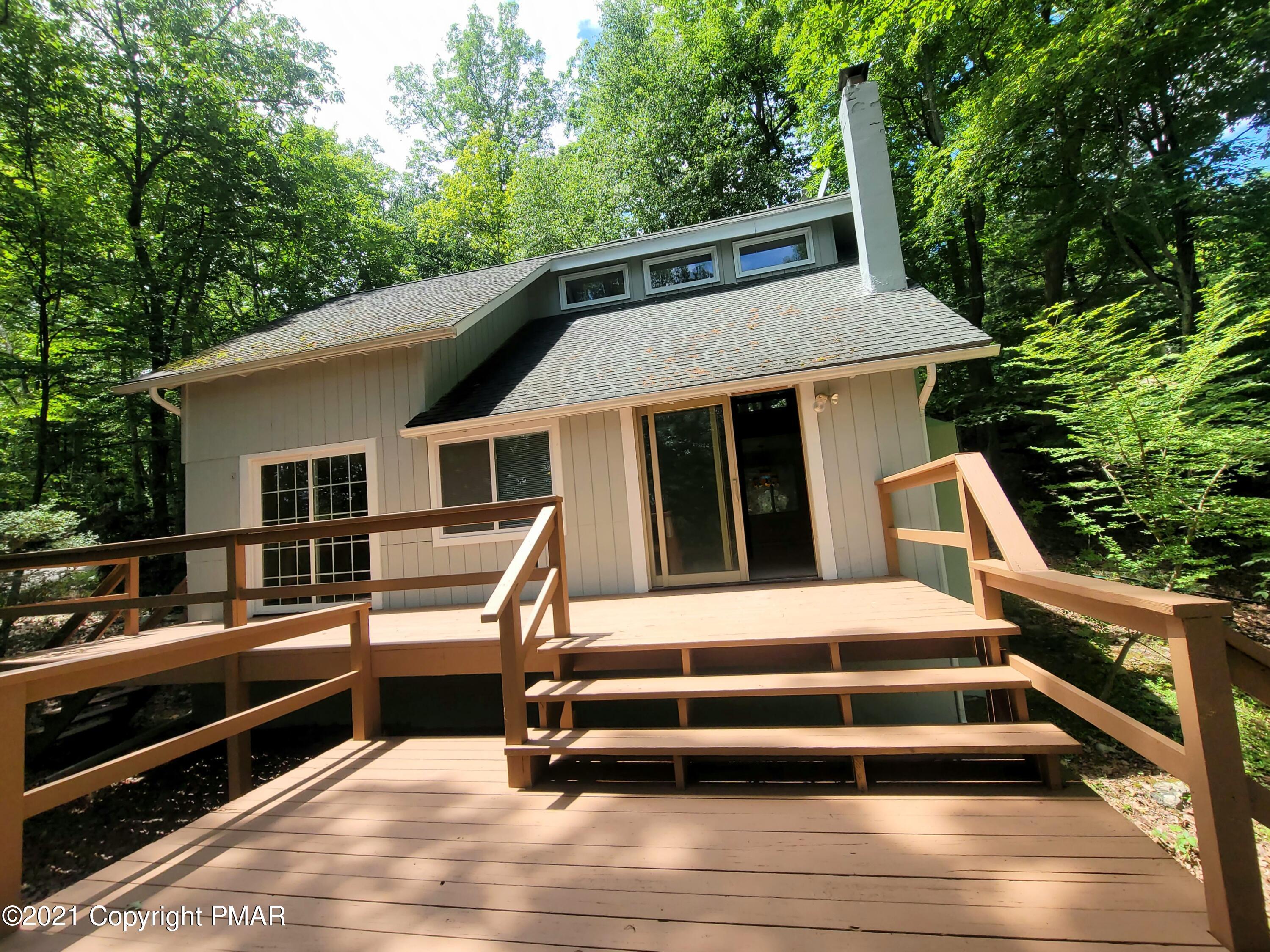 3153 Cherry Ridge Road Bushkill, PA 18324 - Photo 23 of 41 a front view of a house with a yard