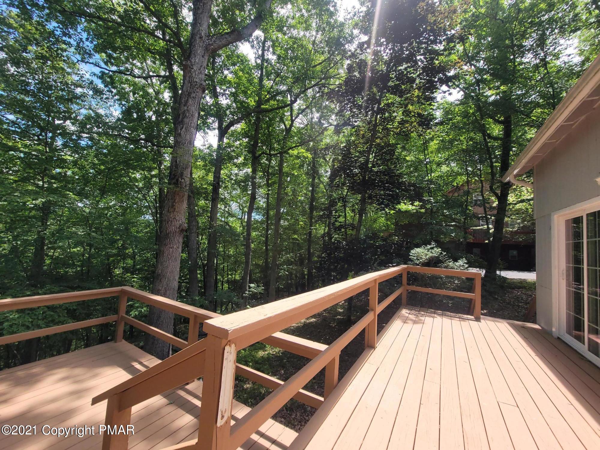 3153 Cherry Ridge Road Bushkill, PA 18324 - Photo 25 of 41 a view of balcony with a large window and wooden floor