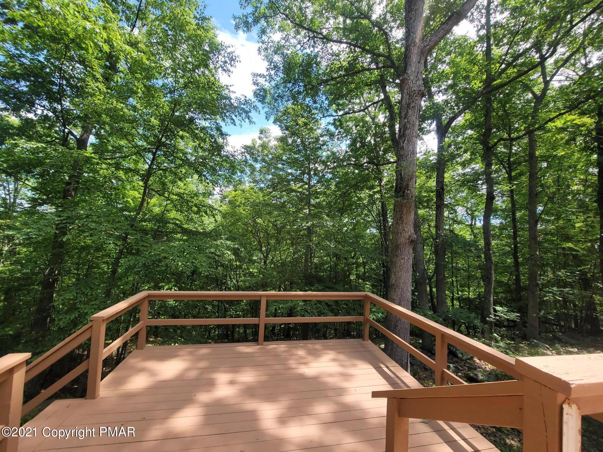 3153 Cherry Ridge Road Bushkill, PA 18324 - Photo 26 of 41 a view of backyard with deck and trees