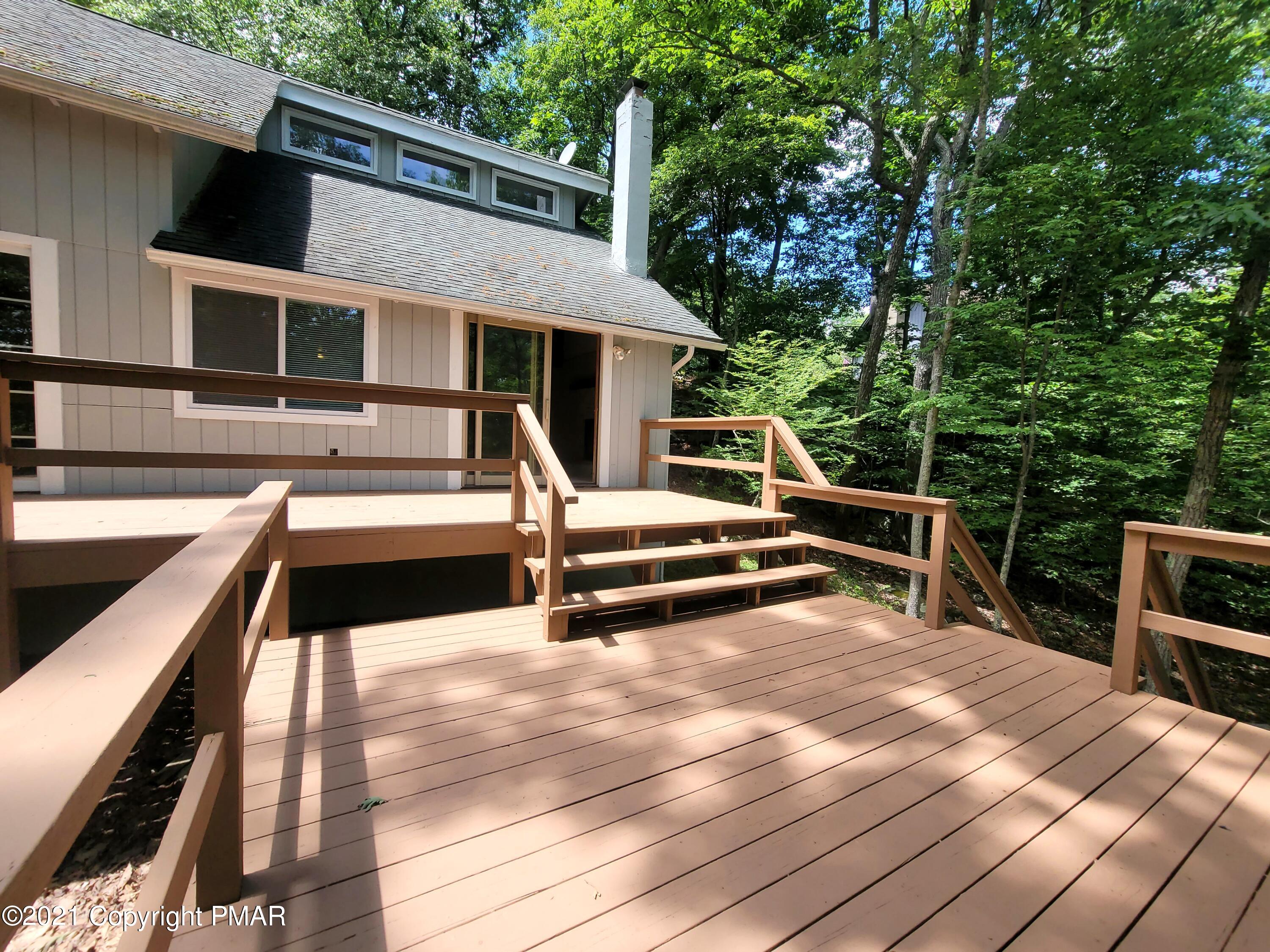 3153 Cherry Ridge Road Bushkill, PA 18324 - Photo 28 of 41 a view of a house with pool and chairs