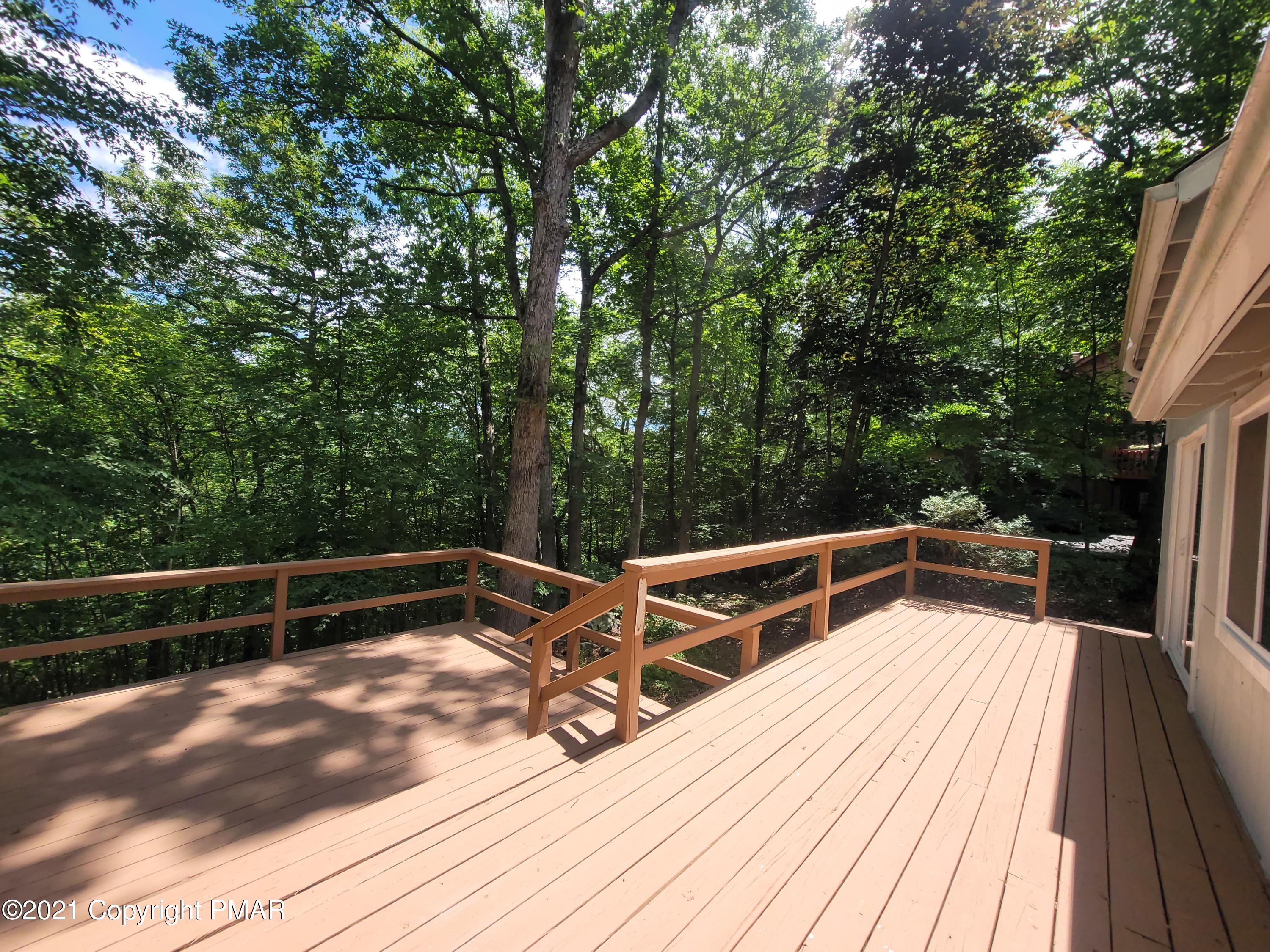 3153 Cherry Ridge Road Bushkill, PA 18324 - Photo 31 of 41 a view of roof deck with chairs and wooden floor