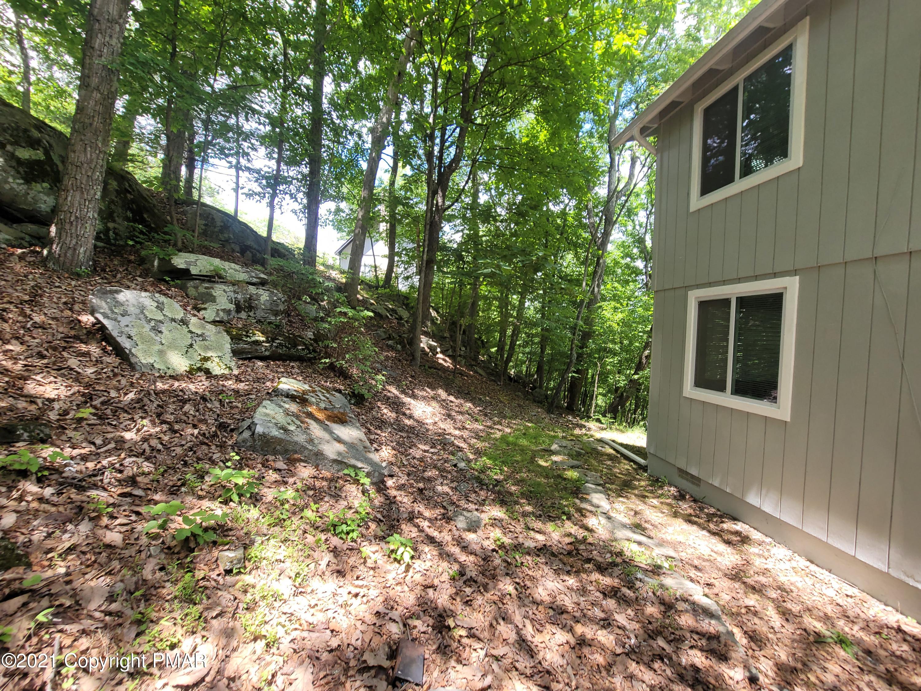 3153 Cherry Ridge Road Bushkill, PA 18324 - Photo 33 of 41 a backyard of a house with lots of green space