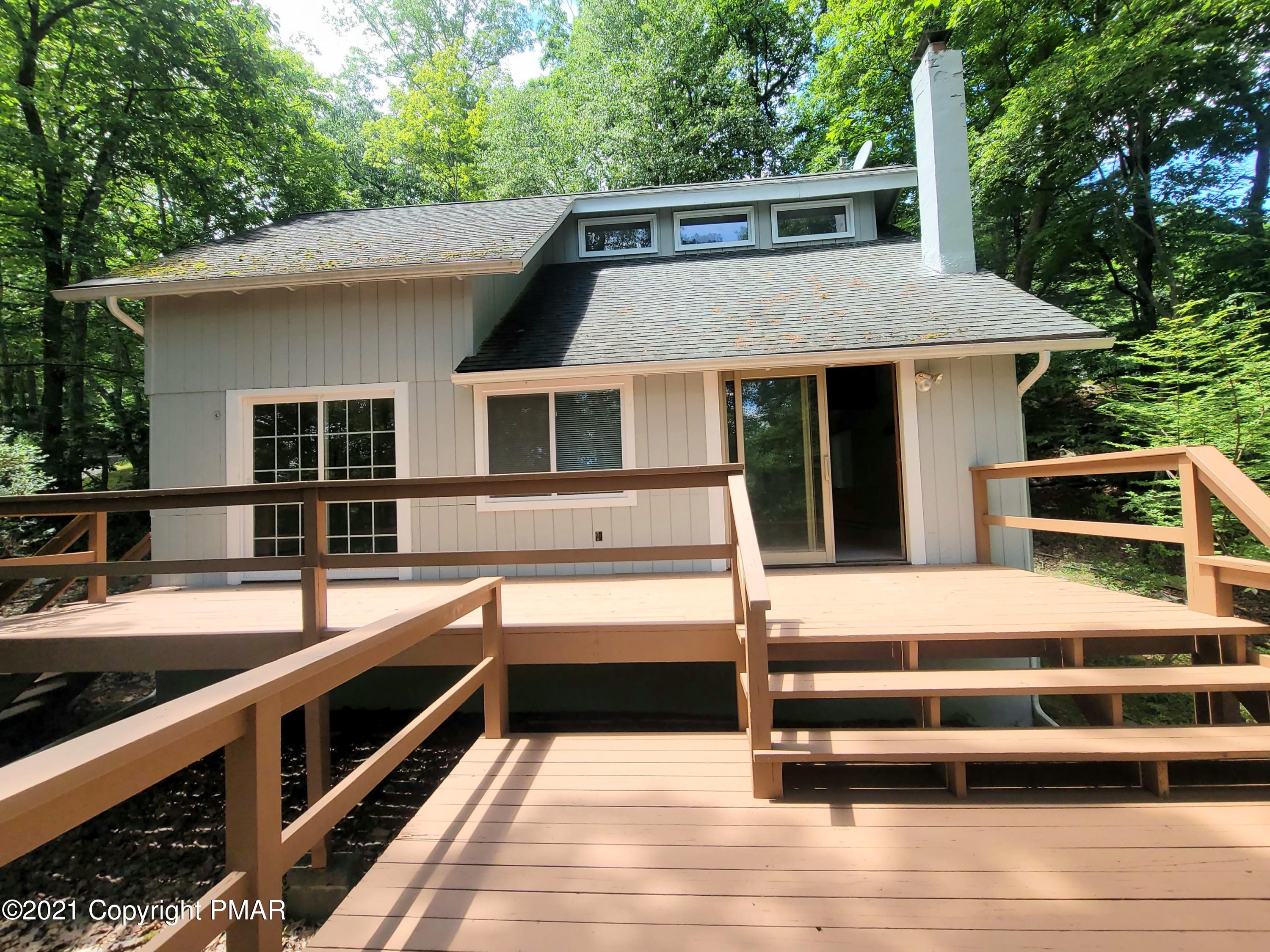 3153 Cherry Ridge Road Bushkill, PA 18324 - Photo 34 of 41 a view of a house with pool and chairs