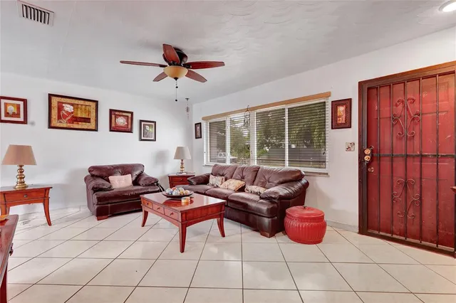 a living room with furniture and a window