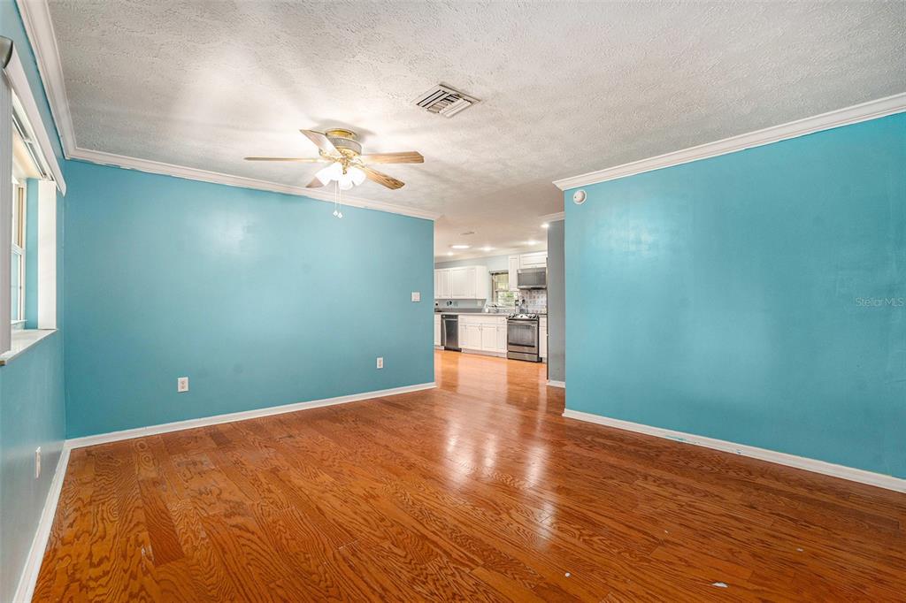 9738 Ray Street Hudson, FL 34669 - Photo 16 of 30 a view of a room with wooden floor
