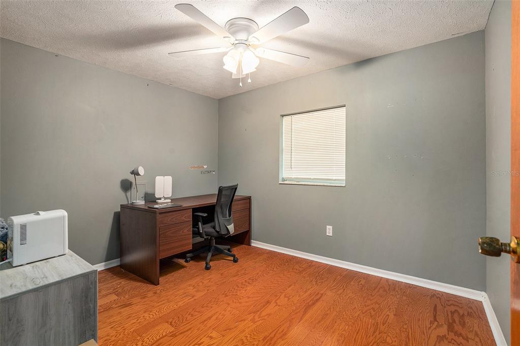 9738 Ray Street Hudson, FL 34669 - Photo 19 of 30 a workspace with furniture and a window