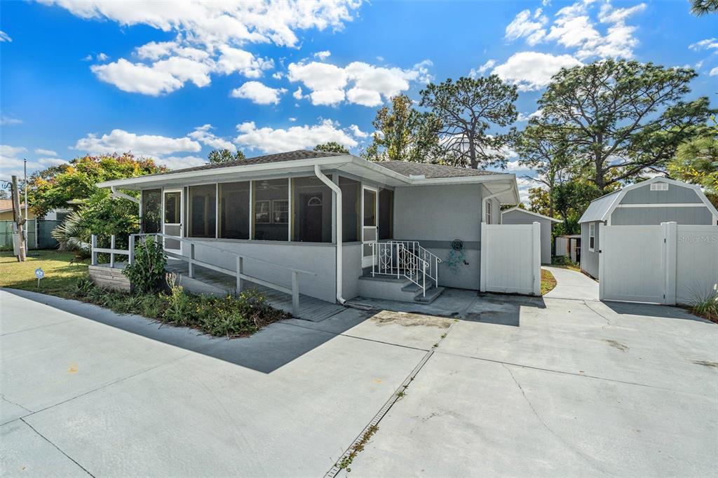 9738 Ray Street Hudson, FL 34669 - Photo 2 of 30 a view of a house with patio